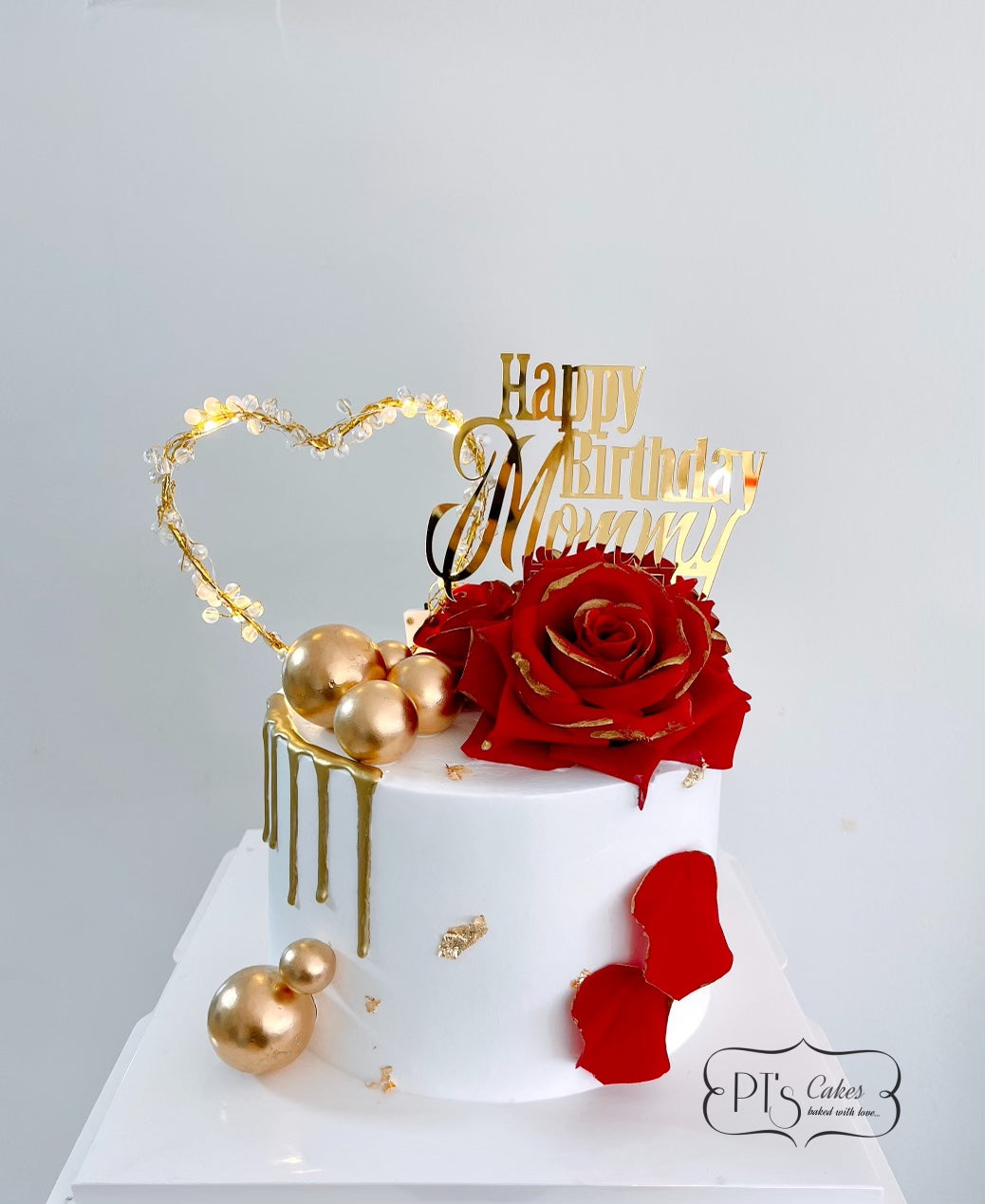 Red rose golden heart cake
